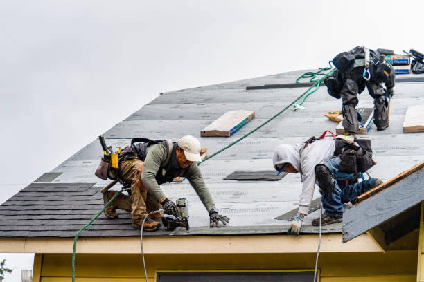 Professional Roofing technician working in Springs, NY